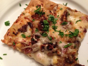 Pizza: Duck Confit, Pear, Shallot, Swiss Cheese, Smoked Gouda Cheese on Smoky Flatbread (Photo Credit: Adroit Ideals)