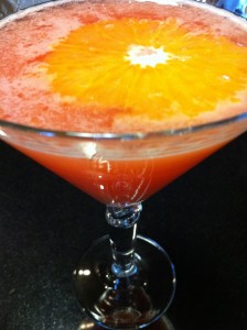 Enjoy a blood orange martini during the holidays (Photo Credit: Adroit Ideals)