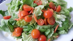 Salad of orange cherry tomatoes, carrots, and Bibb lettuce with Roasted Walnut Oil Dressing (Photo Credit: Adroit Ideals)