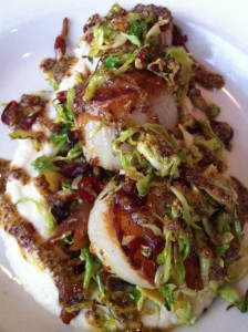Scallops & Shaved Brussels Sprouts over Cheese Grits (Photo Credit: Adroit Ideals)