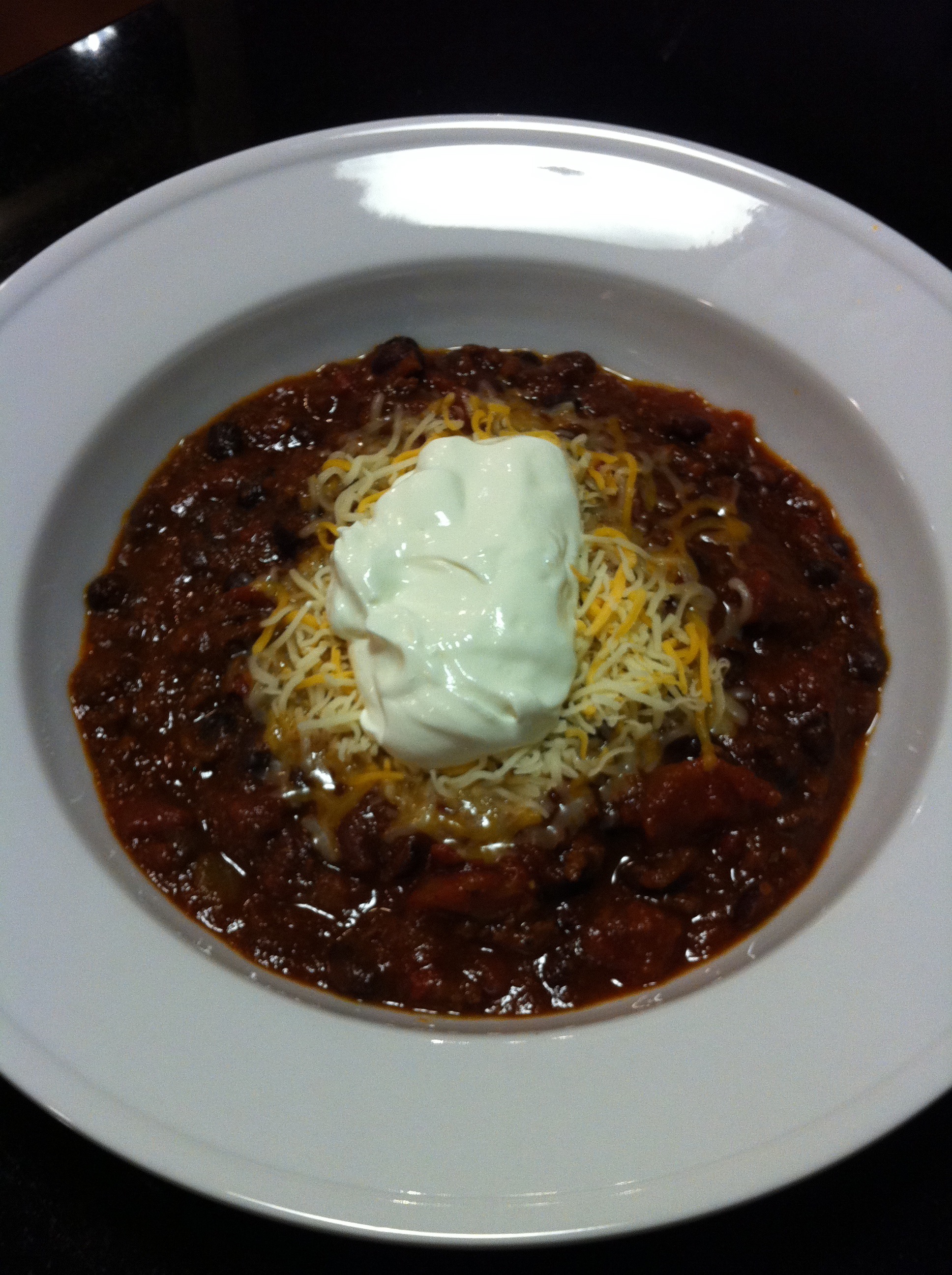 Black Bean Chili with Shredded Cheese and Sour Cream (Photo Credit: Adroit Ideals)