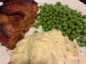 Chive Mashed Potatoes along with Bacon-Topped Meatloaf and Peas (Photo Credit: Adroit Ideals)