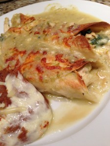 Chicken and Spinach Enchiladas with Green Chile Sauce and a side of Refried Beans! (Photo Credit: Adroit Ideals)