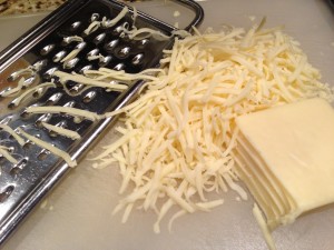 Shredded Monterey Jack cheese is a melty good filling for enchiladas (Photo Credit: Adroit Ideals)