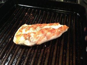 Grilling the chicken in a grill pan (Photo Credit: Adroit Ideals)