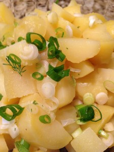 Golden potatoes, sliced scallions, and celery wait for Greek yogurt dressing (Photo Credit: Adroit Ideals)