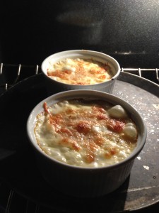 Potatoes au Gratin bubbling in the oven (Photo Credit: Adroit Ideals)