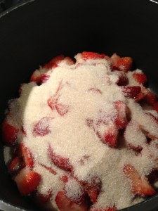 Chopped strawberries, lemon juice, and sugar go into the pan.  (Photo Credit: Adroit Ideals)