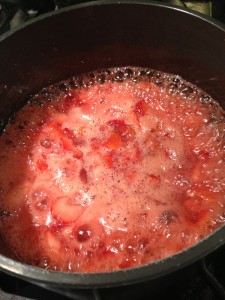 Sweetened strawberries are cooking down into a luscious jam! (Photo Credit: Adroit Ideals)