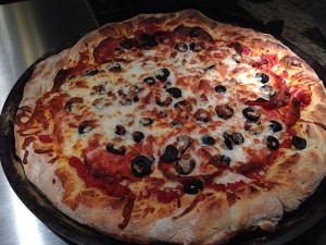 Pepperoni and Black Olive Pizza's done!   (Photo Credit: Adroit Ideals)