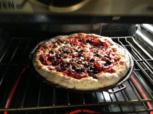 Pepperoni pizza baking in the oven  (Photo Credit: Adroit Ideals)