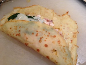 Roll up the filled smoked chicken crepe (Photo Credit: Adroit Ideals)