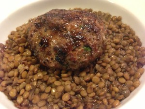 Place the grilled lamb burger over the bed of lentils (Photo Credit: Adroit Ideals)