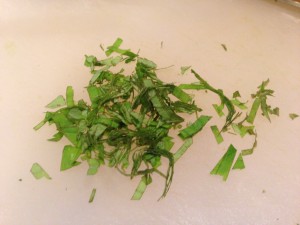 Cut the mint into chiffonade -- basically thin slices  (Photo Credit: Adroit Ideals)