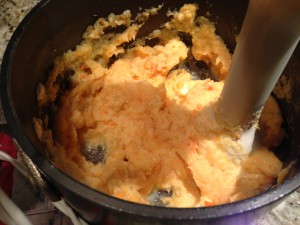 Use a hand blender to puree the cooked parsnip and carrot pieces.  (Photo Credit: Adroit Ideals)