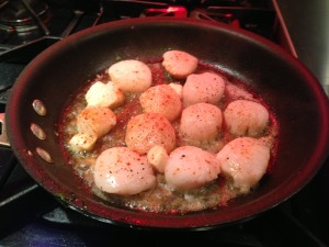 Sear the paprika-seasoned scallops on each side until a light brown (Photo Credit: Adroit Ideals)