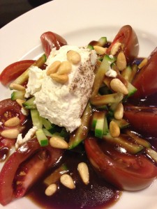 Ripe tomato salad with cucumber chiffonade, tarragon balsamic dressing, peppered goat cheese, and toasted pine nuts. (Photo Credit: Adroit Ideals)