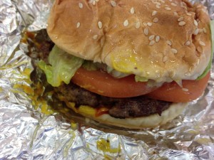 A tasty burger from my all time favorite burger chain started locally in Virginia -- Five Guys! This burger is topped with mustard, ketchup, mayo, lettuce, tomato, and pickles!  (Photo Credit: Adroit Ideals)
