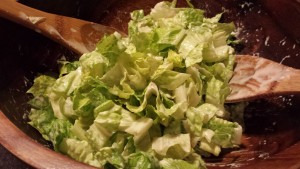 Mixing chopped Romaine Leaves with Caesar Dressing (Photo Credit: Adroit Ideals)