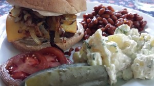 The Best Buffalo Burger with Mayo, Smoked Gouda, Caramelized Onions and sides of Honey Mustard Baked Beans, Dill Potato Salad with Greek Yogurt Dressing and fixin's (Photo Credit: Adroit Ideals)