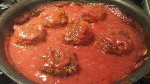 Meatballs keep warm in the tomato red bell pepper sauce (Photo Credit: Adroit Ideals)