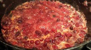 Let the cranberry compote simmer on low for 45 - 60 minutes (Photo Credit: Adroit Ideals)