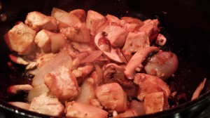 Return the chicken and garlic pieces to the pan  (Photo Credit: Adroit Ideals)