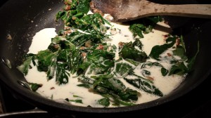Add the cream to the wilted spinach (Photo Credit: Adroit Ideals)