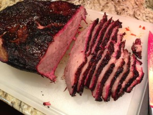 Sliced Smoked Beef Brisket.  Note the pink along the edges.  (Photo Credit: Adroit Ideals)