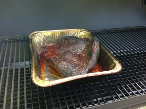 Beef Brisket in the smoker (Photo Credit: Adroit Ideals)