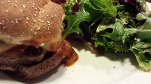 Juicy Italian Burger served with a mixed greens salad (Photo Credit: Adroit Ideals)
