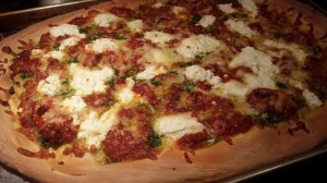 Roasted Tomato, Ricotta, Mozzarella, Garlic and Pesto Pizza -- Hot from the oven! (Photo Credit: Adroit Ideals)