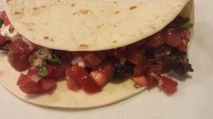 Smoked Pork Soft Taco with Pico de Gallo and shredded Monterey Jack cheese (Photo Credit: Adroit Ideals)