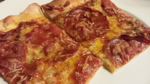 Friday Night Pepperoni and Provolone Pizza slices with drizzle of olive oil (Photo Credit: Adroit Ideals)