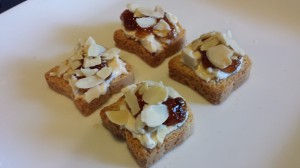Simple Amuse Bouche: Laughing Cow Cheese, Fig Jam, Toasted Sliced Almonds on Mini-Toasts (Photo Credit: Adroit Ideals)