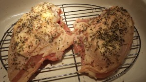 Sprinkle the Herbes de Provence, coarse sea salt, and freshly cracked pepper over the chicken breasts.  (Photo Credit: Adroit Ideals)