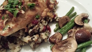 Garlicky Chicken Breast served over Wild Rice Medley with Dried Cranberries and Toasted Nuts.  With a side of Sauteed Haricots Verts and Mushrooms. (Photo Credit: Adroit Ideals)