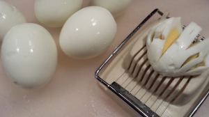 Slice the eggs then chop them (Photo Credit: Adroit Ideals)