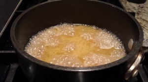 Simmer the Calvados sauce until it reduces a bit and thickens (Photo Credit: Adroit Ideals)