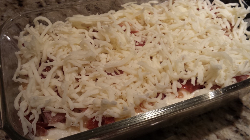 Add more shredded mozzarella  (Photo Credit: Adroit Ideals)