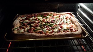 Bake the pizza until the crust is brown and the center is bubbling (Photo Credit: Adroit Ideals)