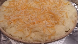 Sprinkle the top with shredded cheeses  (Photo Credit: Adroit Ideals)