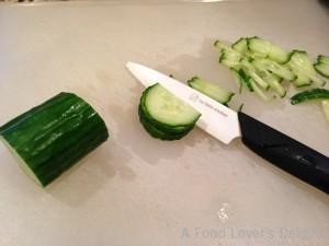Thin slices of cucumber then sliced thinly into strips makes a cucumber chiffonade (Photo Credit: Adroit Ideals)
