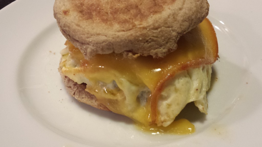 Breakfast Sandwich: Sausage, Smoked Gouda, Fried Egg on a Toasted English Muffin (Photo Credit: Adroit Ideals)
