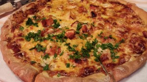 Baked BBQ Chicken Pizza sliced and sprinkled with Chopped Cilantro (Photo Credit: Adroit Ideals)