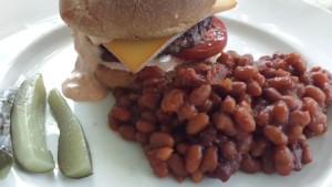 The Best Burger with Special Sauce served with Bubbie's Dill Pickles and a side of Honey Mustard Baked Beans (Photo Credit: Adroit Ideals)