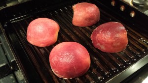 Grill the peach halves in a pan with coconut oil (Photo Credit: Adroit Ideals)