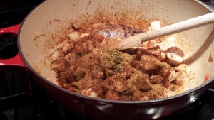Add the spices to the chicken mixture (Photo Credit: Adroit Ideals)