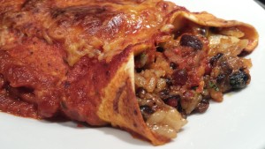 Use the black bean brown rice filling in an enchilada! (Photo Credit: Adroit Ideals)