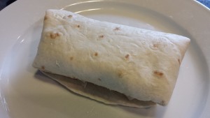 Rolled Burrito ready for slicing (Photo Credit: Adroit Ideals)